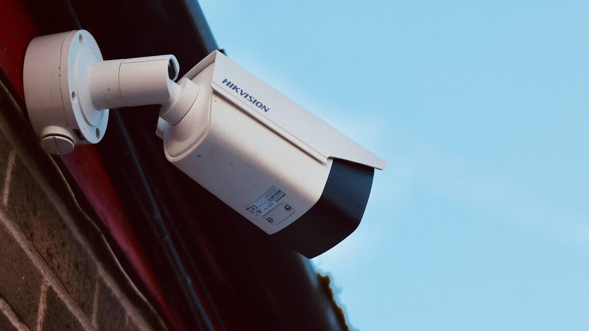 Hikvision bullet camera mounted on a building — installed by J4 Security Systems